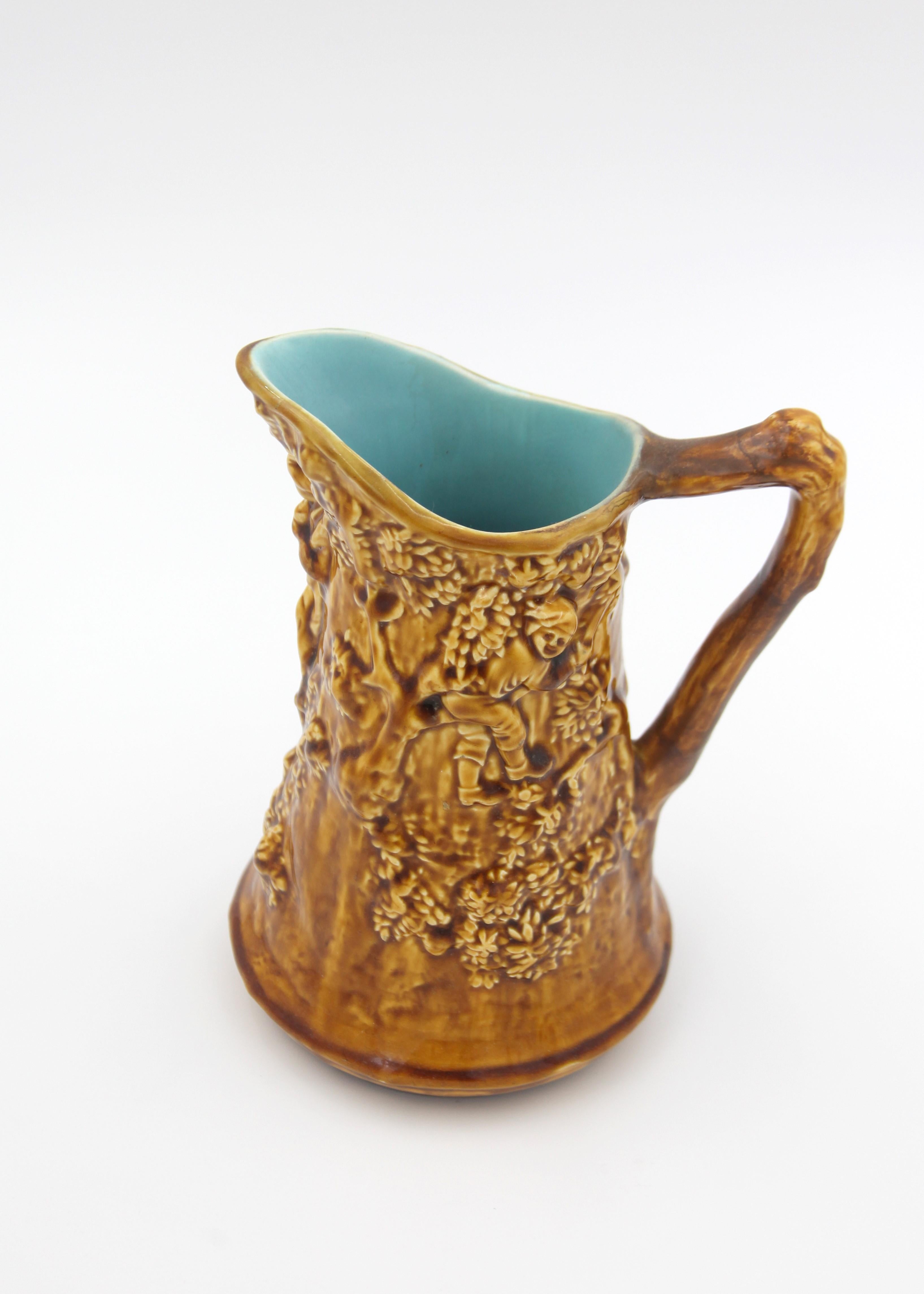 Mellow down with history and pour out a tale from the 19th century with this majolica pitcher from Sarreguemines. Admired for its unique mustard hue, this historical piece of pottery adds a tinge of vintage charm to your ceramic collection. As the