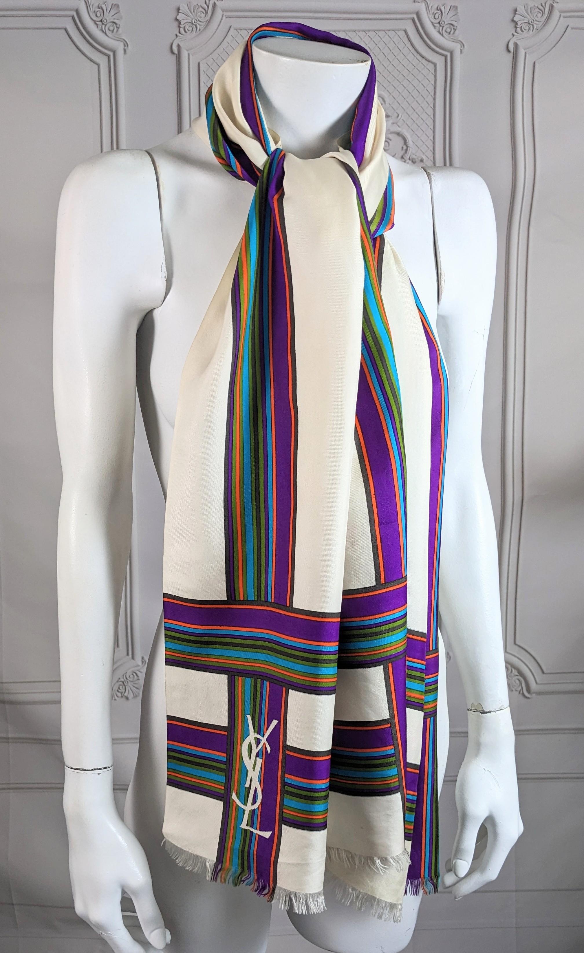 Large Early YSL Large Silk Twill Scarf from the 1970's. Early logo placement with vibrant striped patterns by the House of Yves Saint Laurent, often styled with tailored suits in the period. 1970's France.