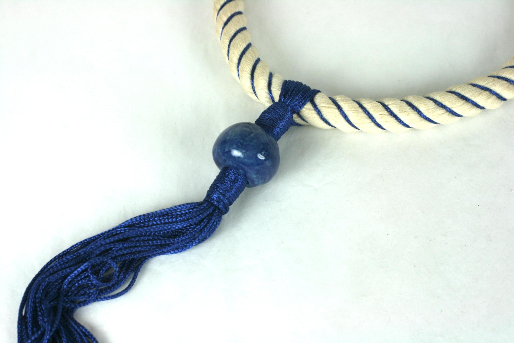 Rare Yves Saint Laurent Haute Couture Necklace Spring Summer 1966. Of nautical inspiration composed of white cotton rope with blue silk and rayon passementerie detail. Focal long tassel pendant and artisan made ceramic bead, gilt metal end caps and