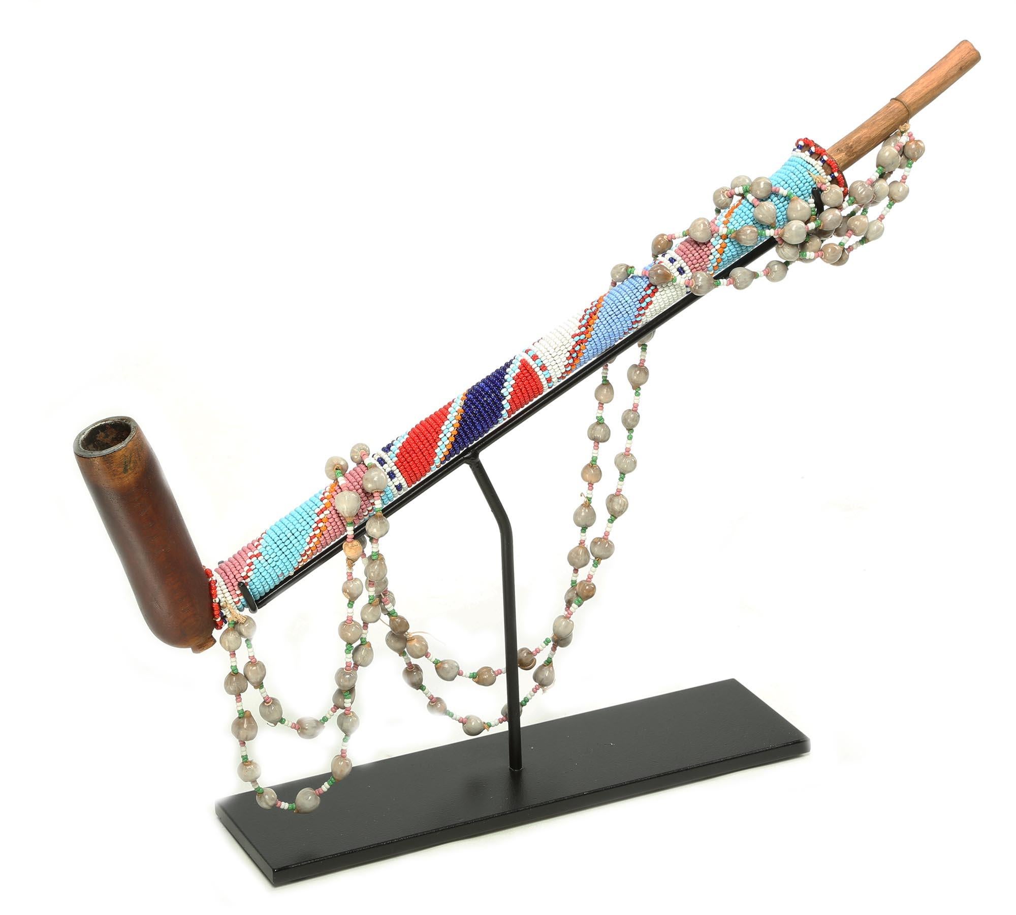Hand-Carved Early Zulu Carved Wood Pipe with Beaded Stem and Strap on Stand South Africa For Sale