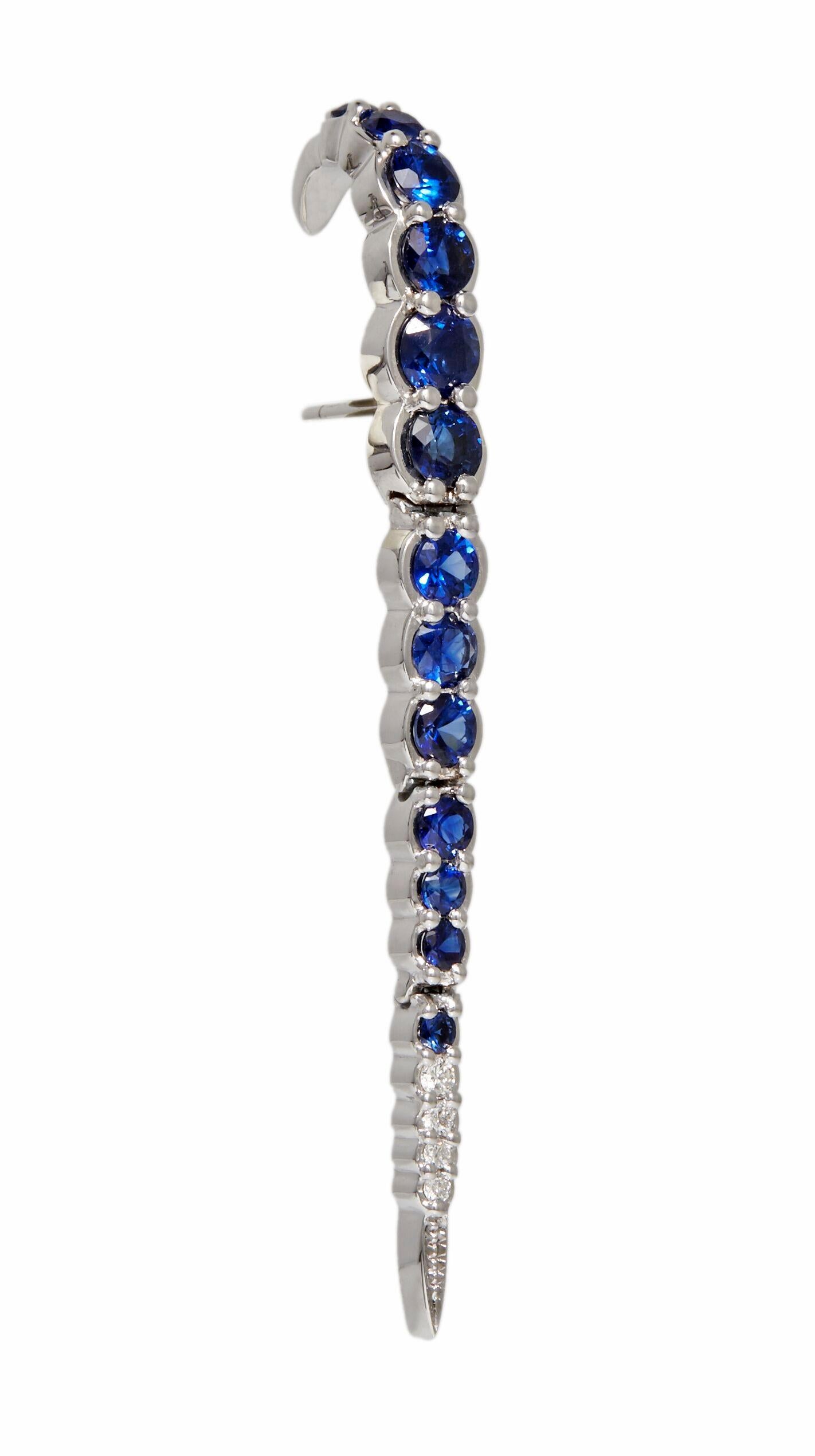 Designed exclusively by Ara Vartanian, this single earring has been created in 18K White Gold, with 3,09ct (three carats and nine points) worth of Blue Sapphires in a inverted round faceted cut, along with four accented White Diamonds in a round