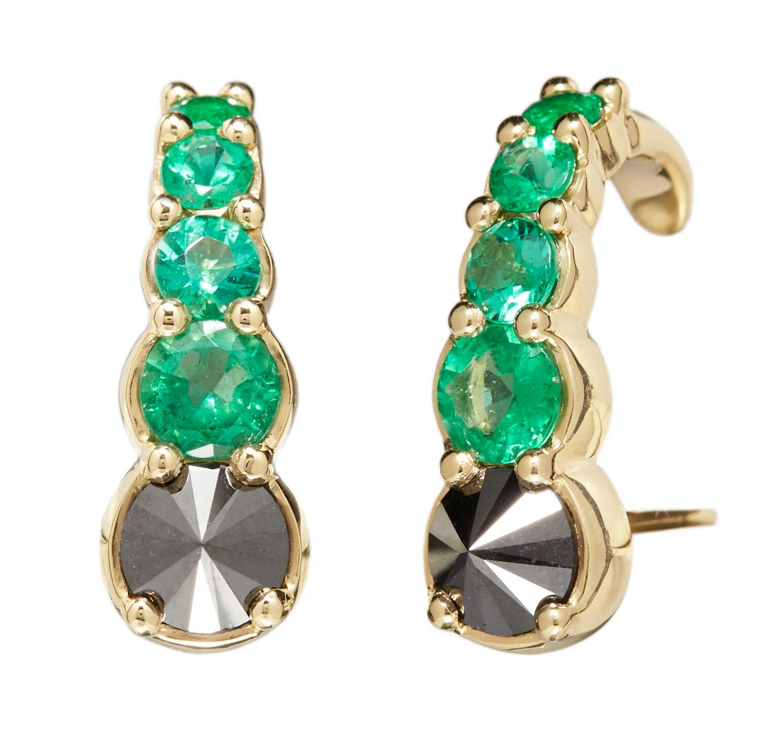 Designed exclusively by Ara Vartanian, these earrings have been created in 18k Yellow Gold, adorned with eight round faceted cut Emeralds, with a total weight of 1,25ct (one carat and twenty-five points),  along with two Black Diamonds in a round