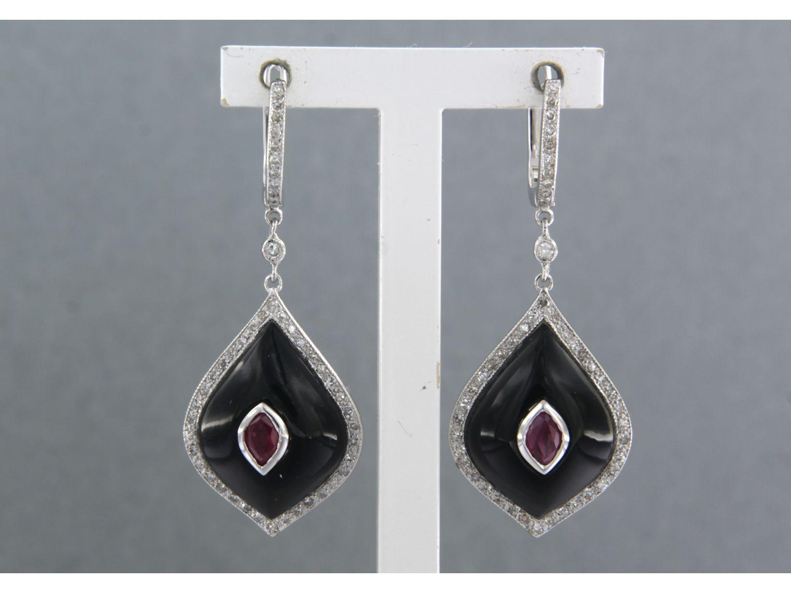 14k white gold earrings set with sapphire, onyx and single cut diamonds. 0.40ct - F/G - VS/SI

detailed description:

the size of the earring is 3.7 cm long by 1.4 cm wide

weight 5.9 grams

set with

- 2 x 1.4 cm x 1.2 cm drop shape cabuchon cut