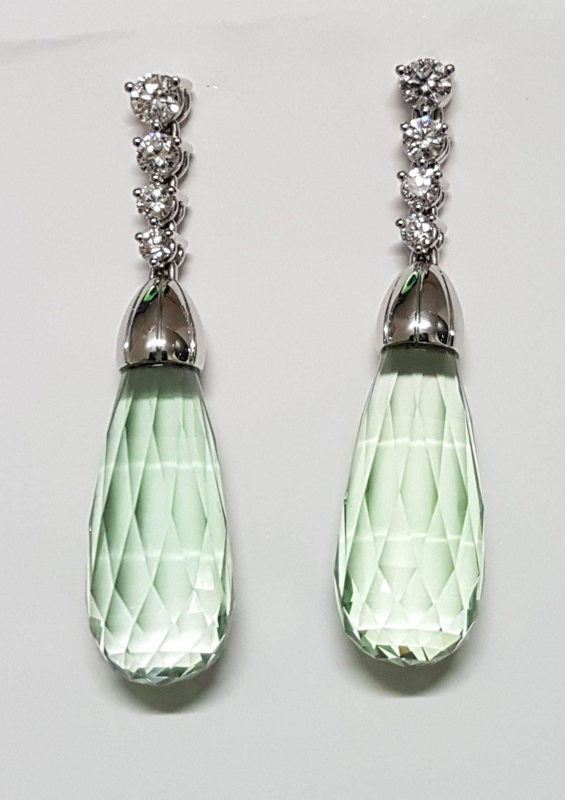 Marvelous earrings, 750/0 white gold, diamonds and prasiolite briolettes.
Prasiolite briolettes together 18.14 carats, diamonds with a total weight of 0.51 carats, H/si. Total length of earrings 3,5 cm / 1.38 inches
Fitting necklace available to