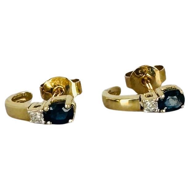 Earrings 14 carat gold with blue sapphire and brilliant cut diamonds For Sale