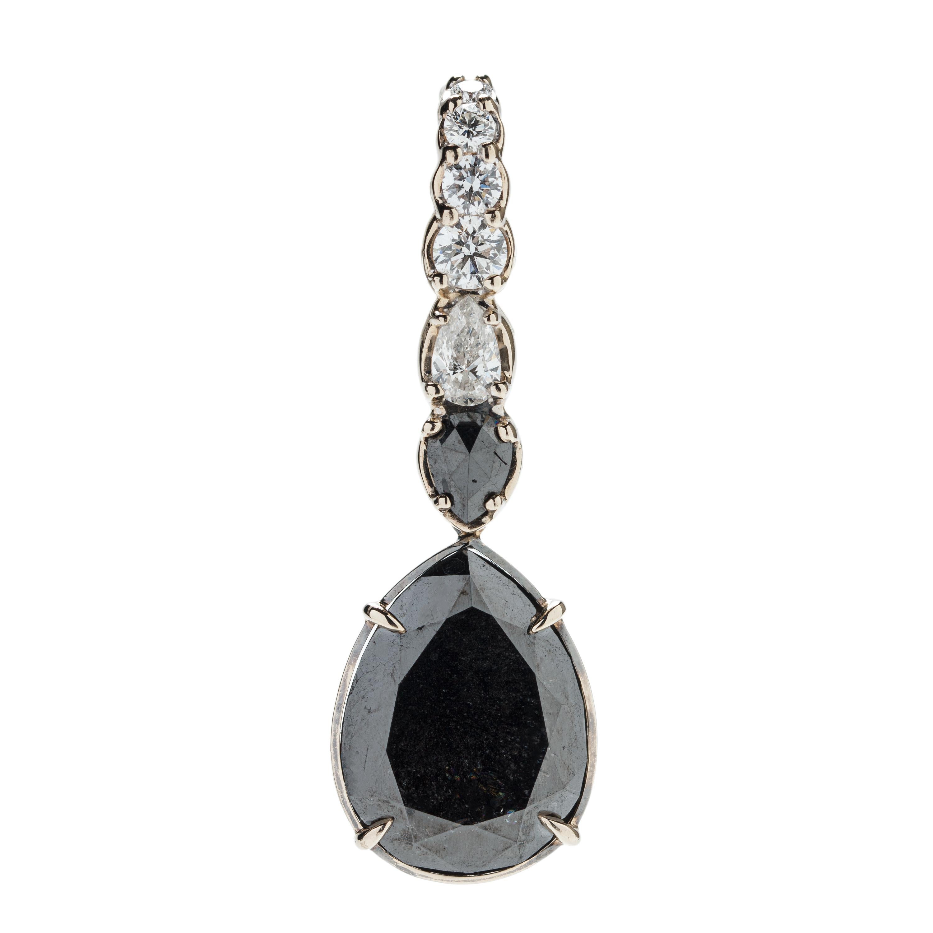 Designed exclusively by Ara Vartanian, this pair of earrings has been created in 18K White Gold, along with 47,9ct (forty-seven and nine points) worth of Black Diamonds in a drop Cut, along with a further total amount of 2,47ct (two carats and