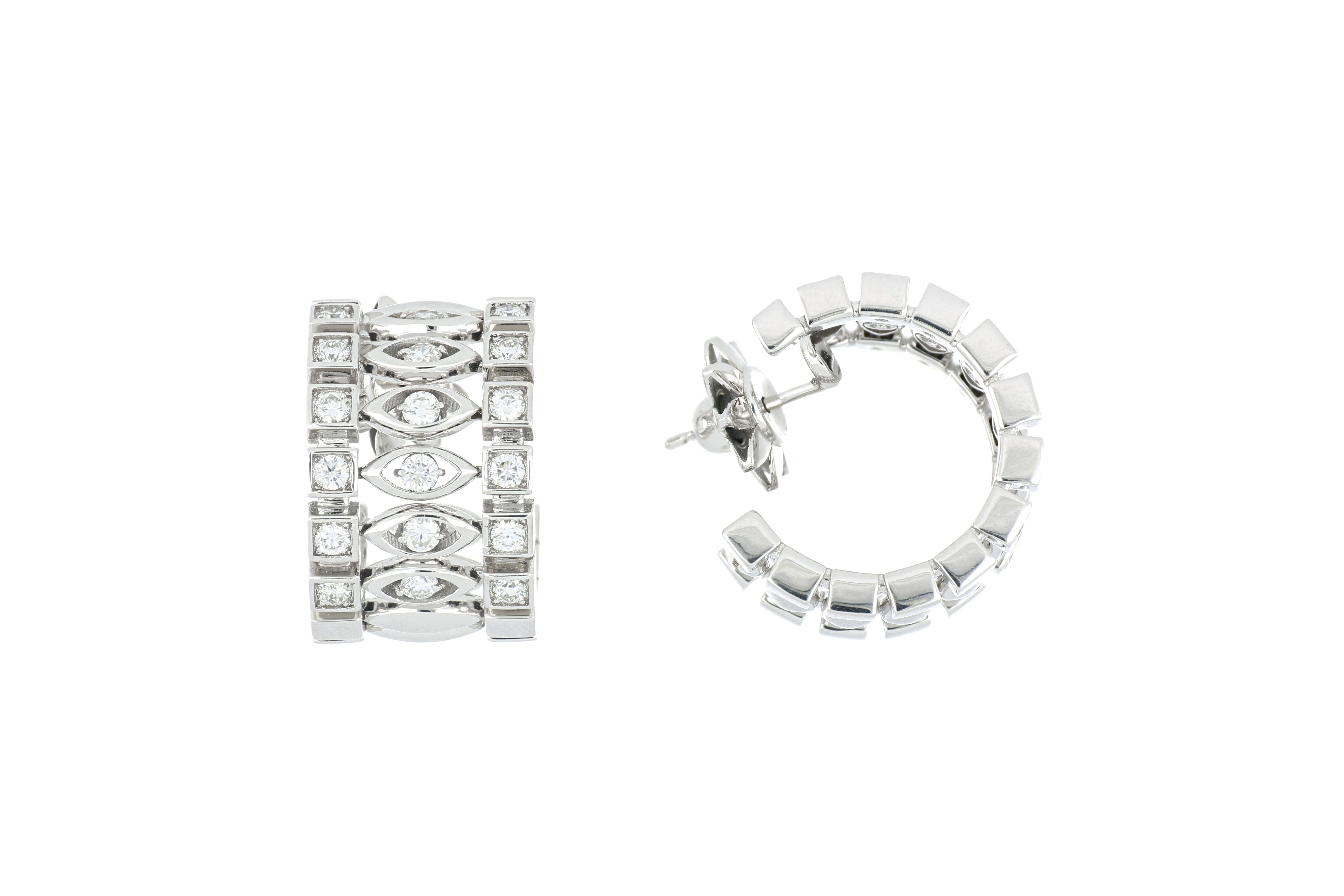 Inspired by the strong, bold, and compelling Greta Garbo, these earrings are elegant and stunning. These phenomenal earrings have a beautiful pattern of soft, curved elongated ovals and bold, strong squares. These radiant 18k white gold earrings are