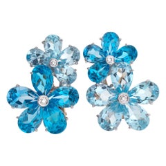Earrings 18k White Gold, Rhapsody in Blue, Aquamarine
Blue Topaz Flower Style Earrings 18k White Gold, Rhapsody in Blue, Aquamarine
Blue Topaz Flower Style