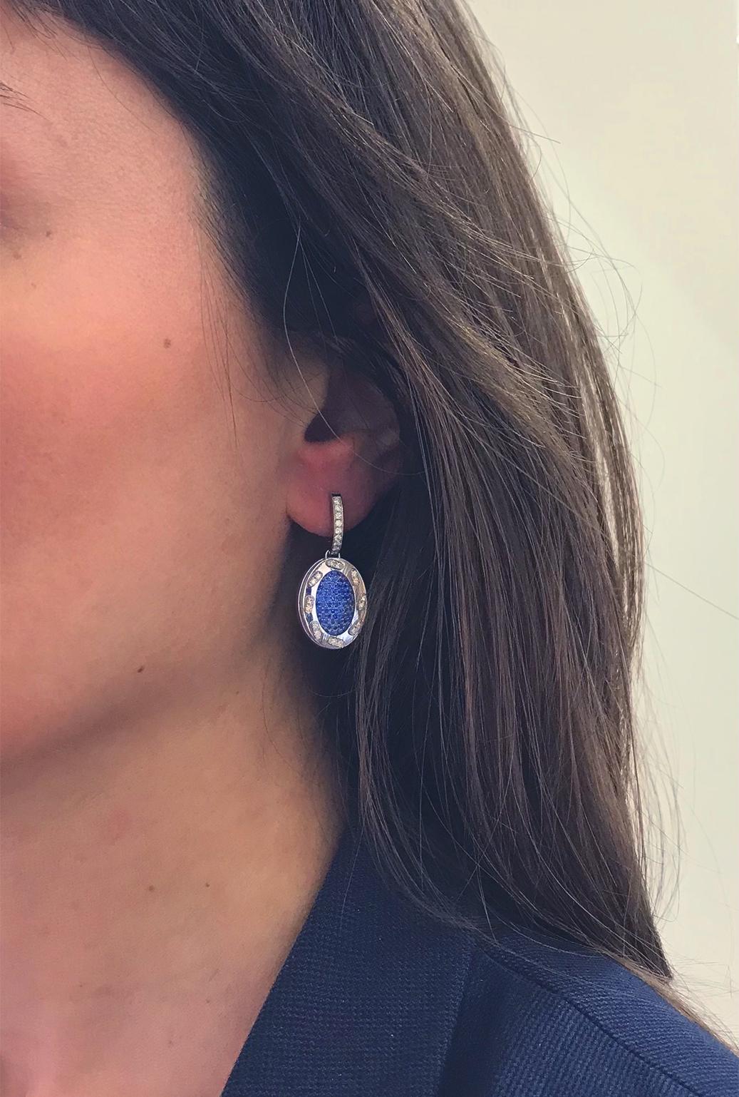 Earrings 18kt gold, Blue Sapphires, Diamonds from The Iconic Omles Collection.
A Story behind This Collection by Angeletti,  which Recalls the Patch, or Scrap; the Gold Frame Hosts a Series of Diamonds (n.50 stones ct. 0.41) , Arranged in the