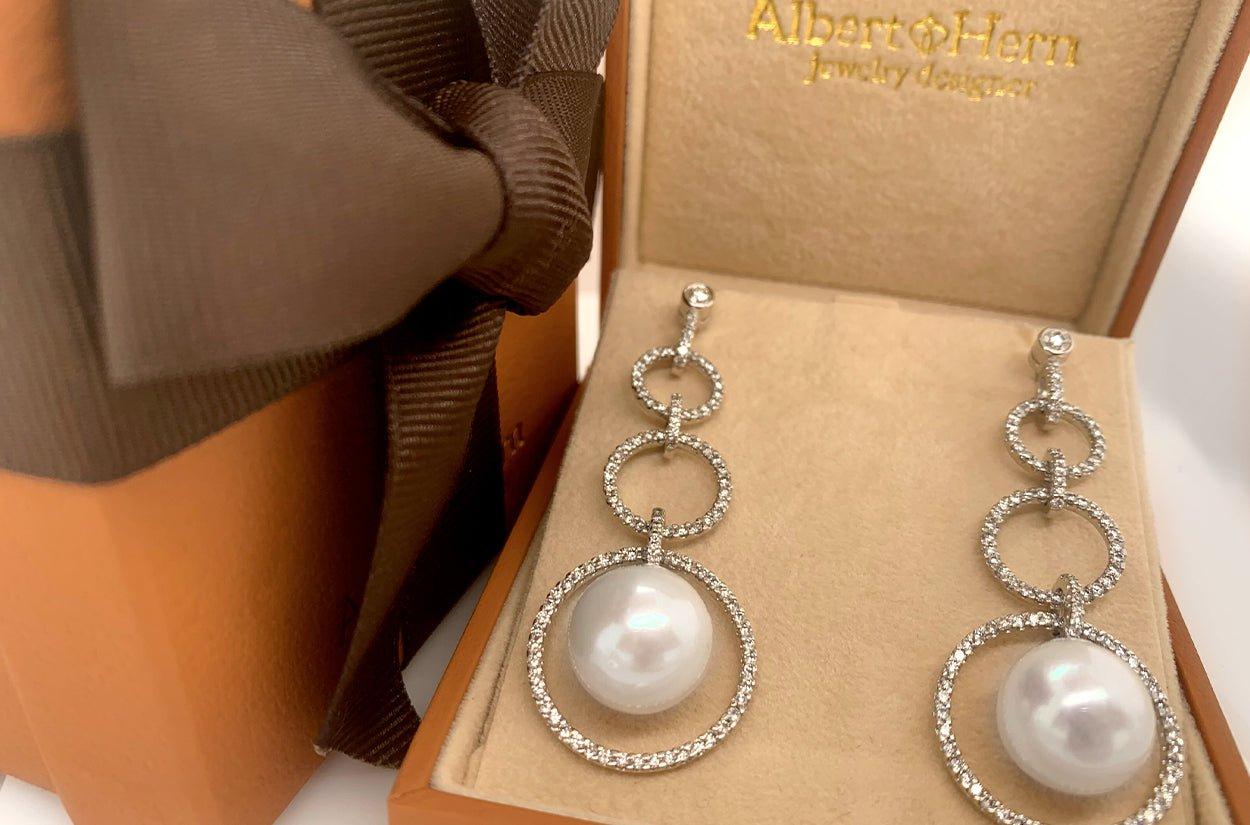 Grace and sophistication come together in this stunning piece, crafted in radiant 18kt white gold. Featuring two luminous 12.5 mm pearls—each hand-selected for their exceptional luster—and accented with a total of 2.40 carats of brilliant diamonds,