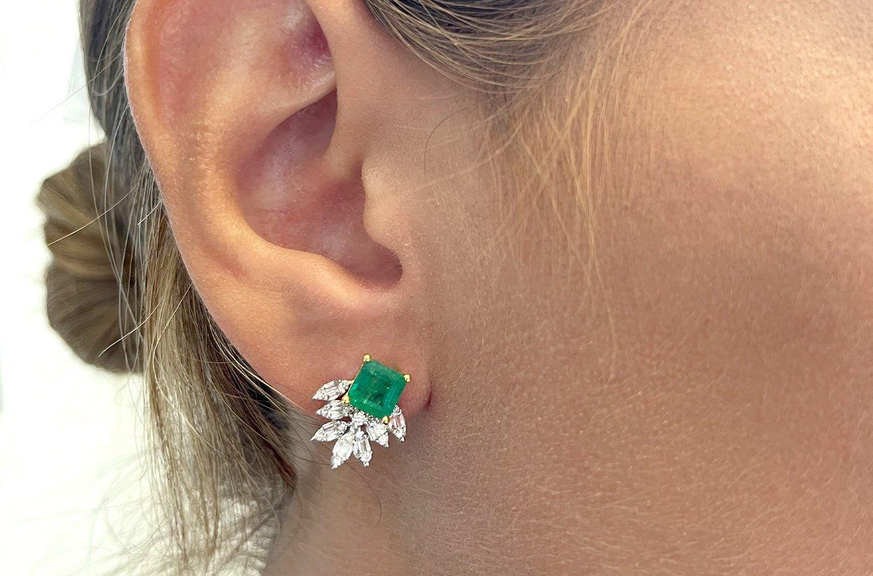 These earrings are made in 18kt gold and features center high quality emeralds, illusion marquise  shape effect . The marquise shape gives a sense of elongation,  and their placements creates a captivating visual illusion. The combination of