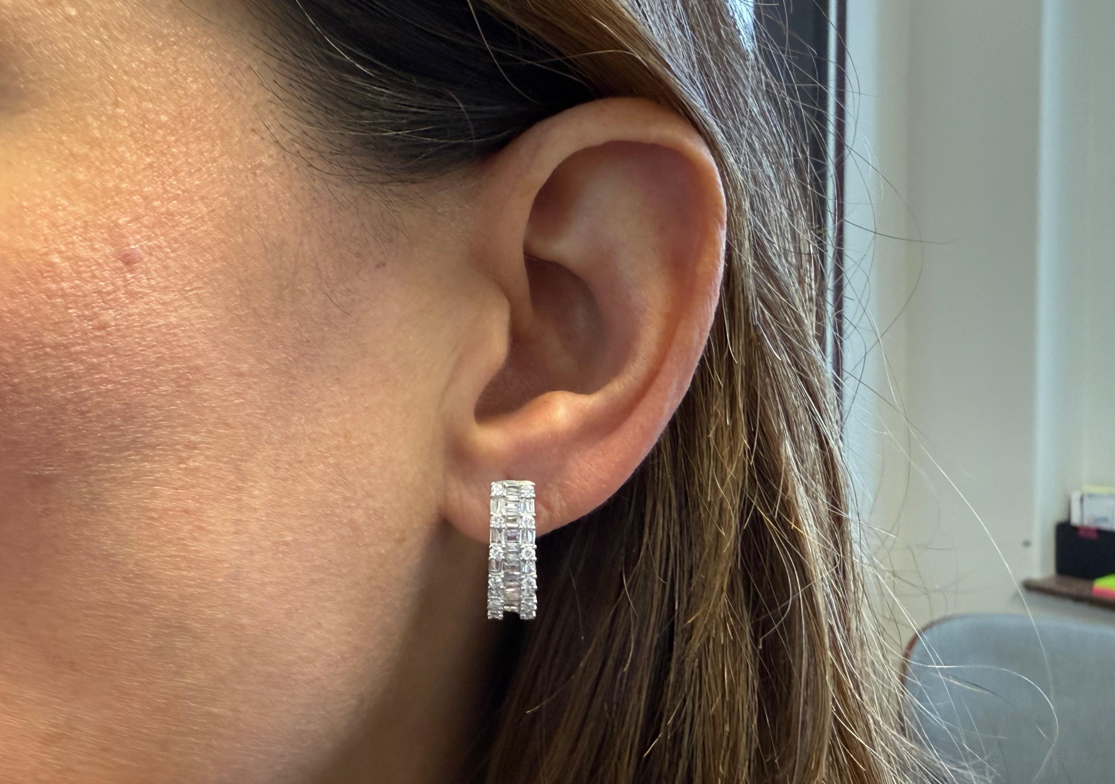 18kt white gold earrings create an illusion with baguettes 0.64 carats and rounds cut diamonds 0.44 carats, for a look that's simply enchanting.