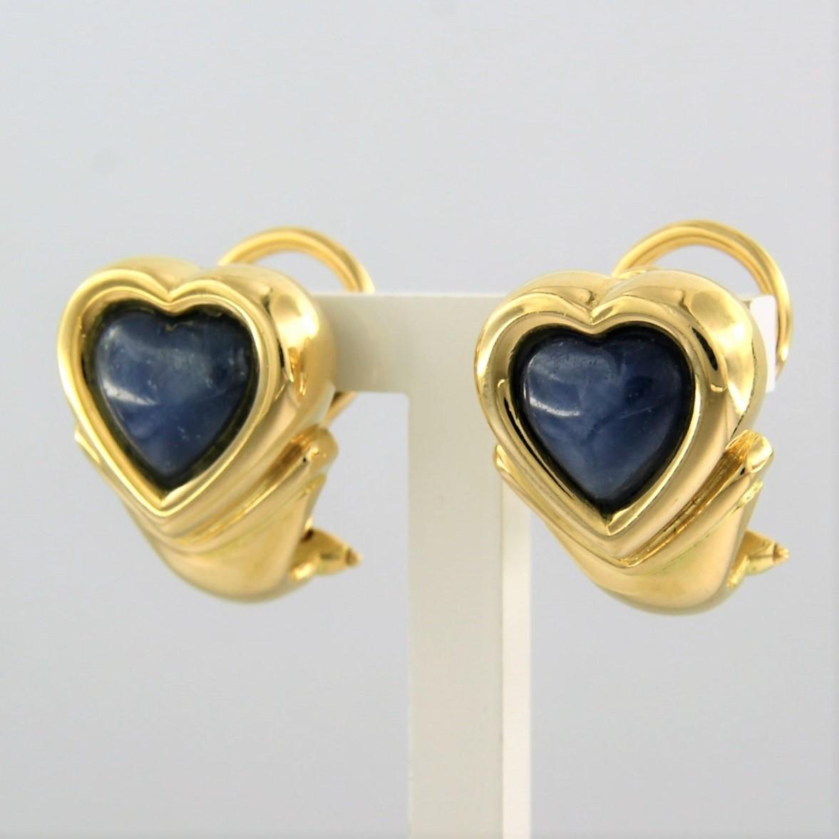 18 kt yellow gold ear clips set with labradorite - dim. 1.8 cm x 1.4 cm

detailed description:

size of the ear clips is 1.8 cm by 1.4 cm wide

Total weight 18.1 grams

put with

- 2 x 9.4 mm x 8.5 mm heart shape cabachon cut labradorite

color