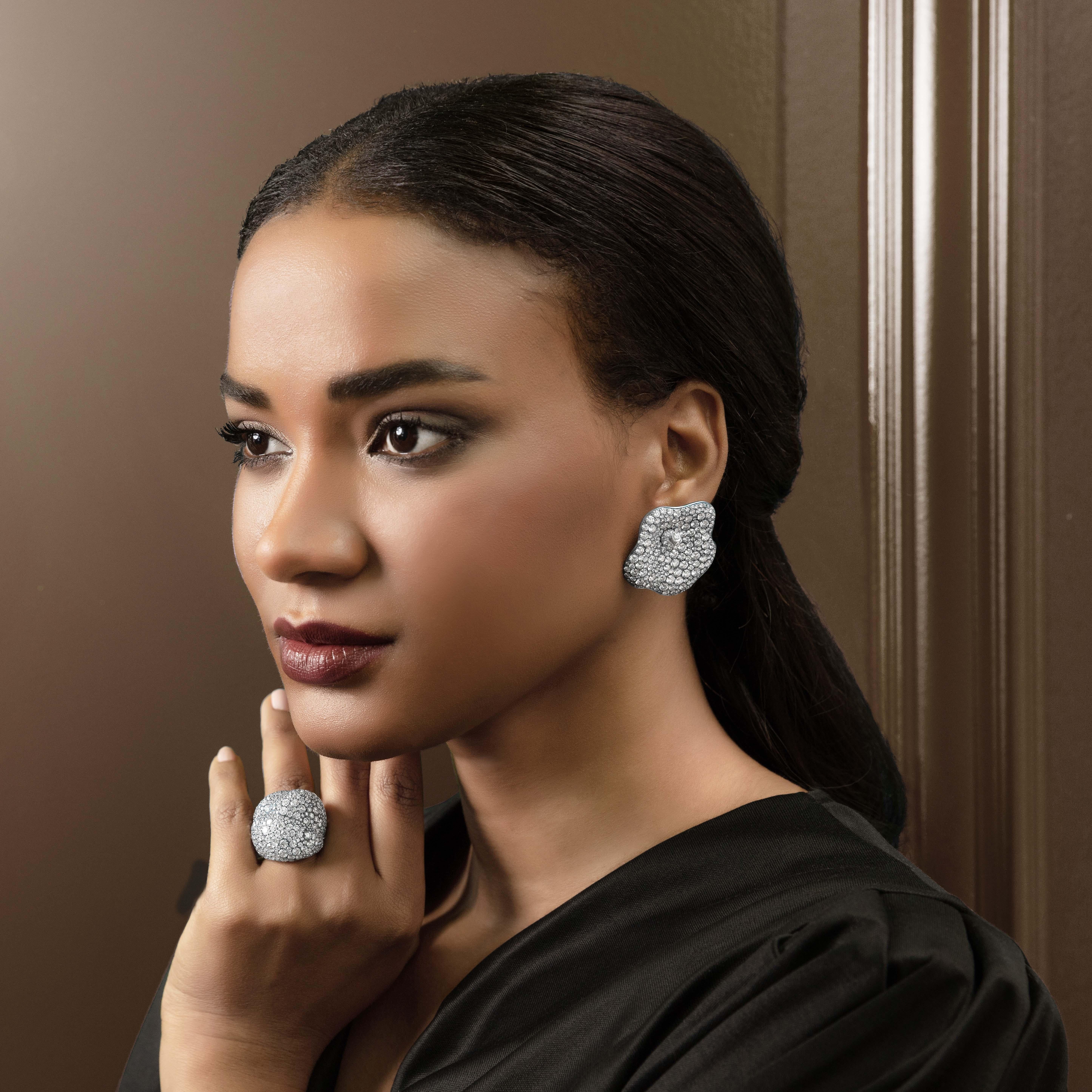 These earrings are part of Kilimanjaro Collection.

Exquisitely made and reminiscent of the tender snow falling on Africa’s highest mountain. A place of mystical beauty and fearlessness, Mount Kilimanjaro’s snow tops, serve as a muse to this