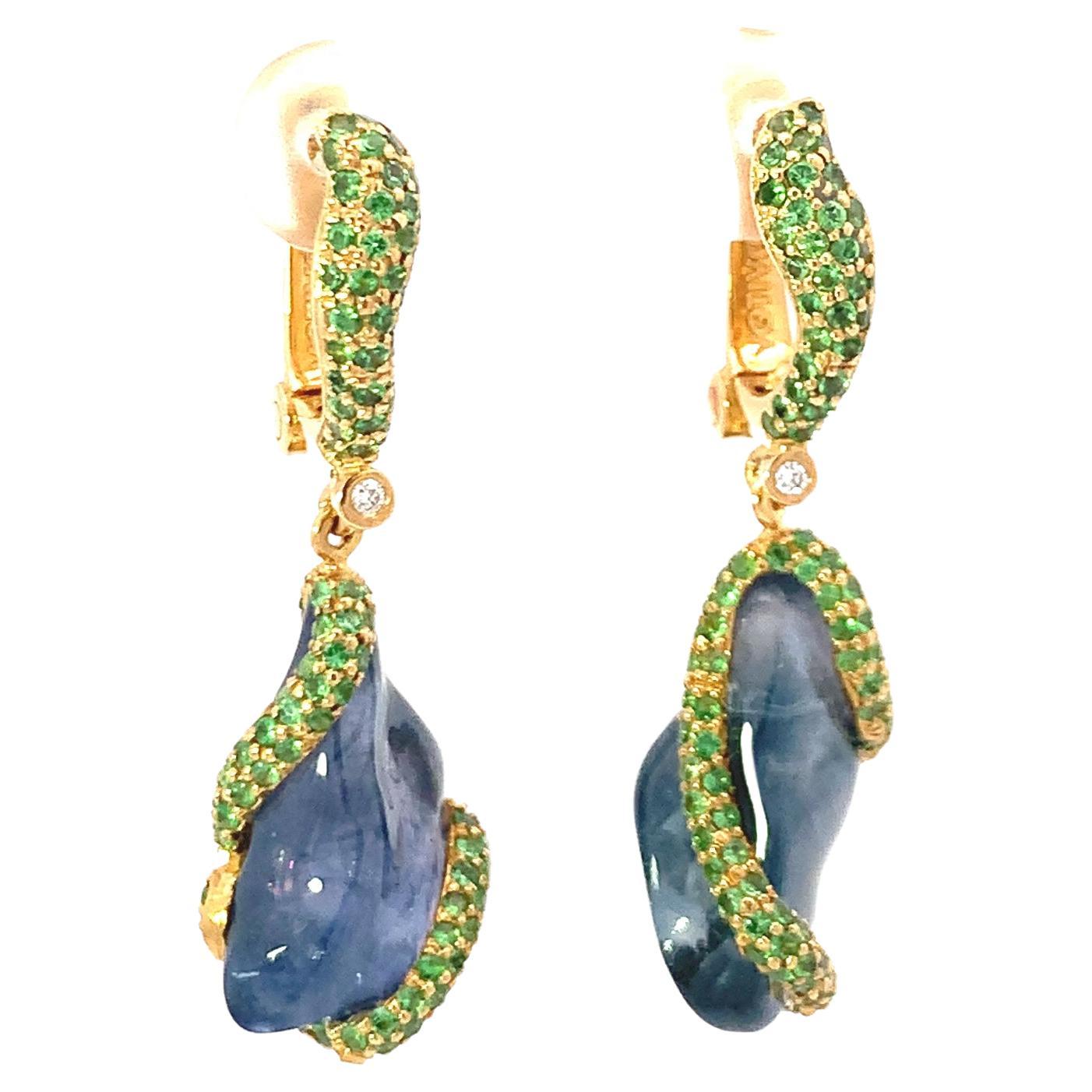 In the Summer Blues Earrings from VOTIVE's Organic Collection, the mesmerizing purple sapphire emerges as the focal point, capturing the essence of seasonal serenity. Showcased in 18k yellow gold, these earrings exemplify the brand's dedication to