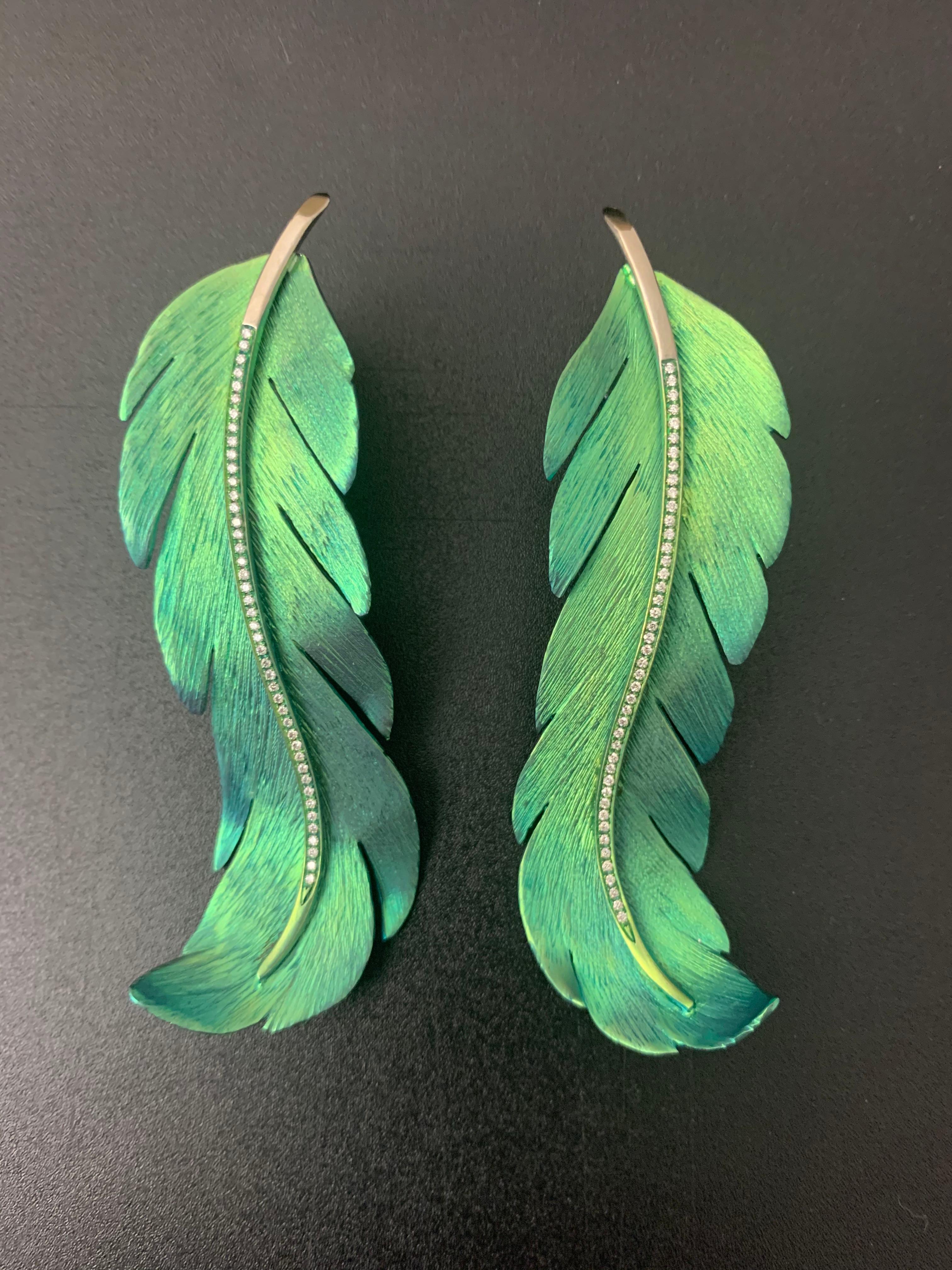 Titanium and diamonds Earrings feather

Earrings feather titanium and gold 3.65 gr
88 diamonds brilliant cut 0.33 Cts 
These earrings are perfect with casual outfit and special evening.
Their color brings light and hapiness.
On request : Custom-made