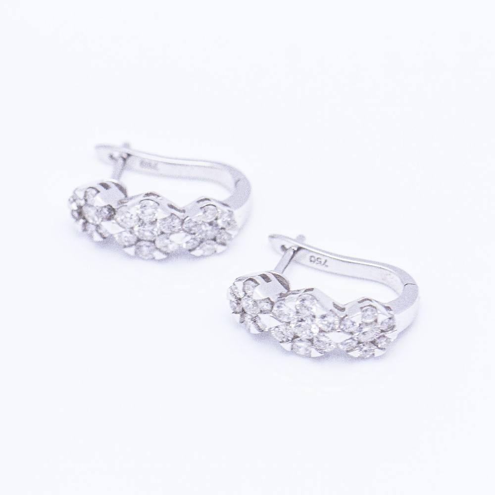 Earrings in White Gold for woman  42x Diamonds in brilliant cut with a total weight of 1,38ct. in H/Si quality  Clip closing  18 kt. white gold  3,88 grams.  Length 1,5cm  Brand new product only available on the web  Ref.: D359169SI