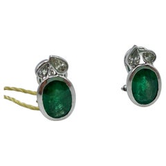 Earrings in 18 Kt White Gold, Emeralds and Pear Cut Diamonds