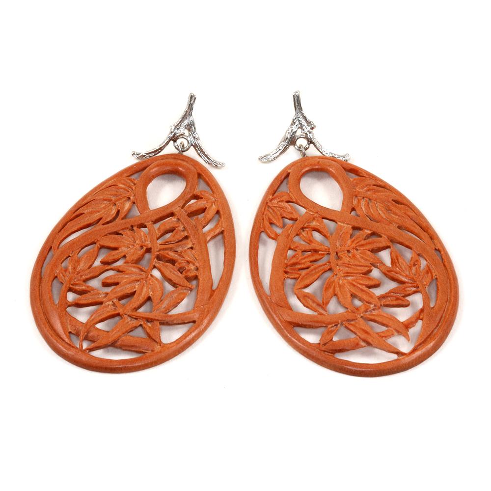 These drop earrings in 18k white gold feature carved bamboo with a tropical motif. 

The Objects Organique Collection is an invitation to connect with the elements—Earth, Air, Fire, Water. This one-of-a-kind creation integrates pure power from