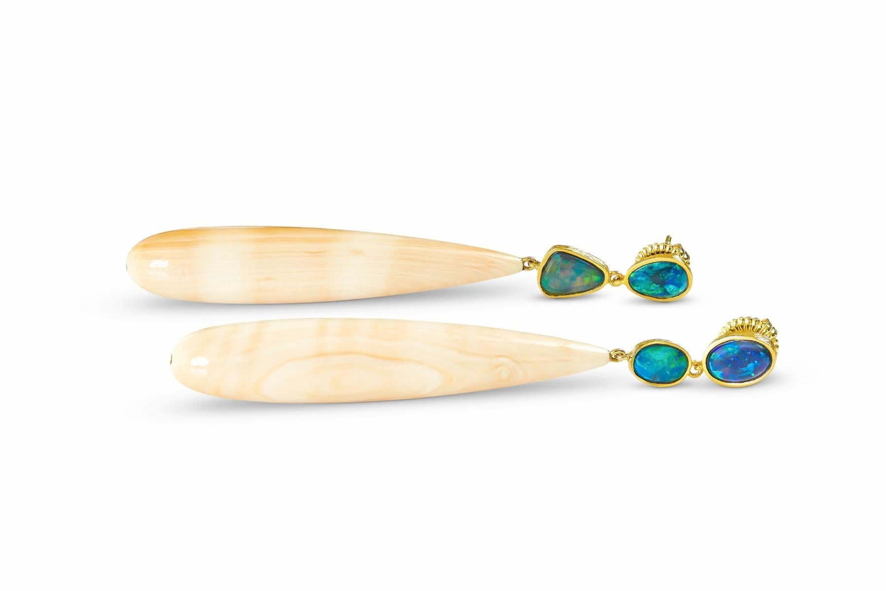 These drop earrings in 18k yellow gold feature four opals and cameo shell briolettes. 

The Skipping Stones Collection features gems smoothed and polished to mirror a glassy lake. The collection is dedicated to life’s ripple effect, in which the