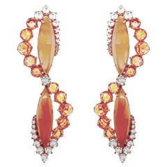 Earrings in 18kt gold with orange moonstone, orange sapphires & natural diamonds