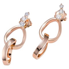 Boucles d'oreilles en or rose 18k martelé et diamants blancs.