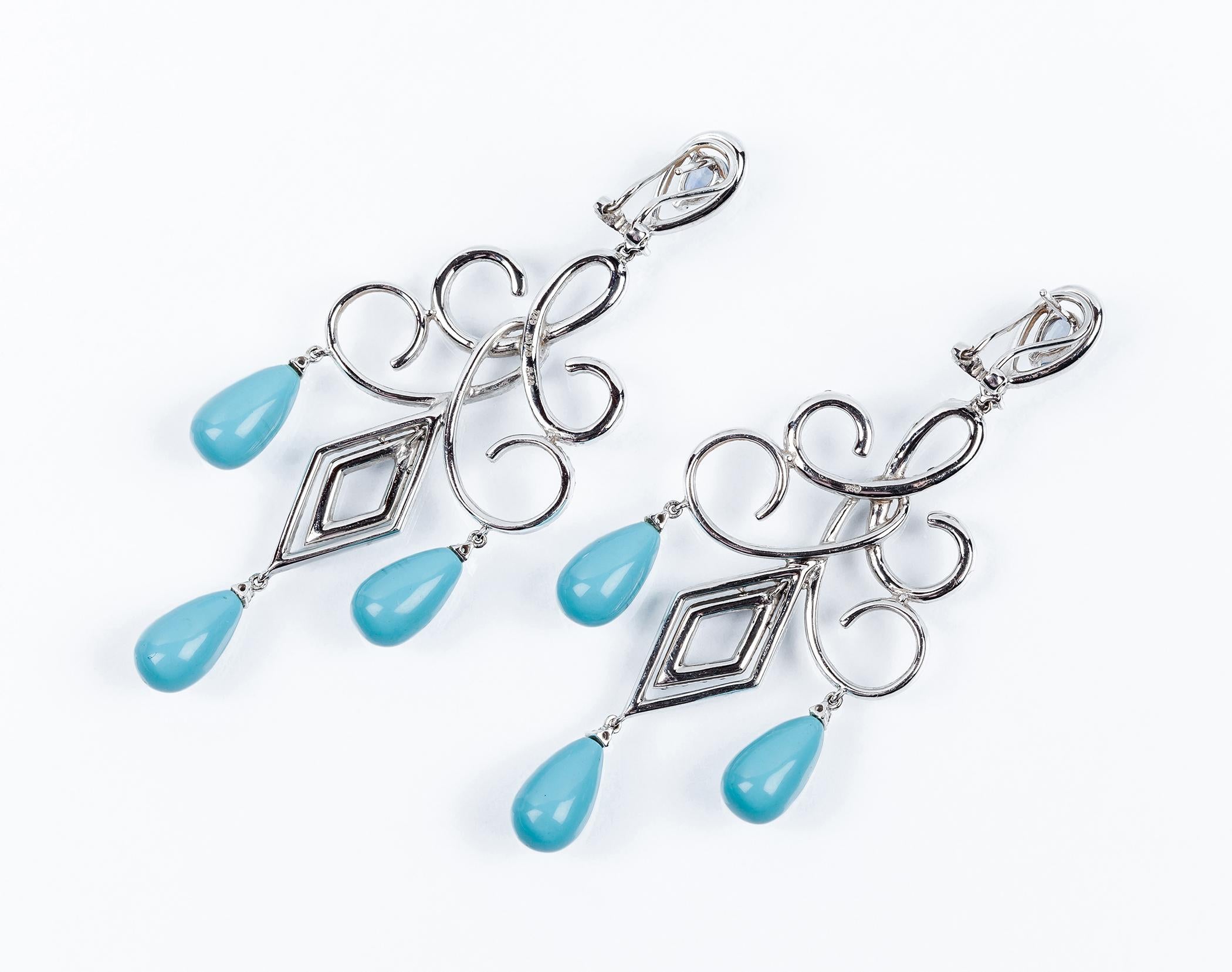 Long earrings in white gold with turquoise drops and arabesque fretwork with white diamonds and blue sapphiers.
170 Diamonds approx 1,95ct.
Length 80mm / 3.14in.
Weight 21,1 gr total 
Irama Pradera is a Young designer from Spain that searches always