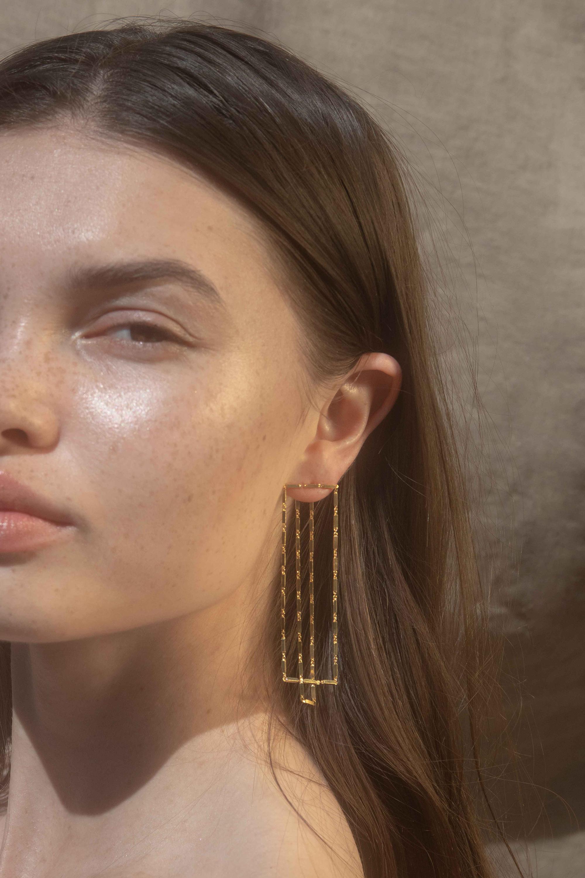 Disco EXTRA earrings 

18 karat gold plated sterling silver chain earrings that consists of rectangular motifs linked to each other. These earrings are very lightweight and can be worn in all occasions. Model is wearing silver version.

Hand-crafted