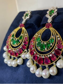 Earrings of emeralds, rubies and diamonds in 18 karat gold