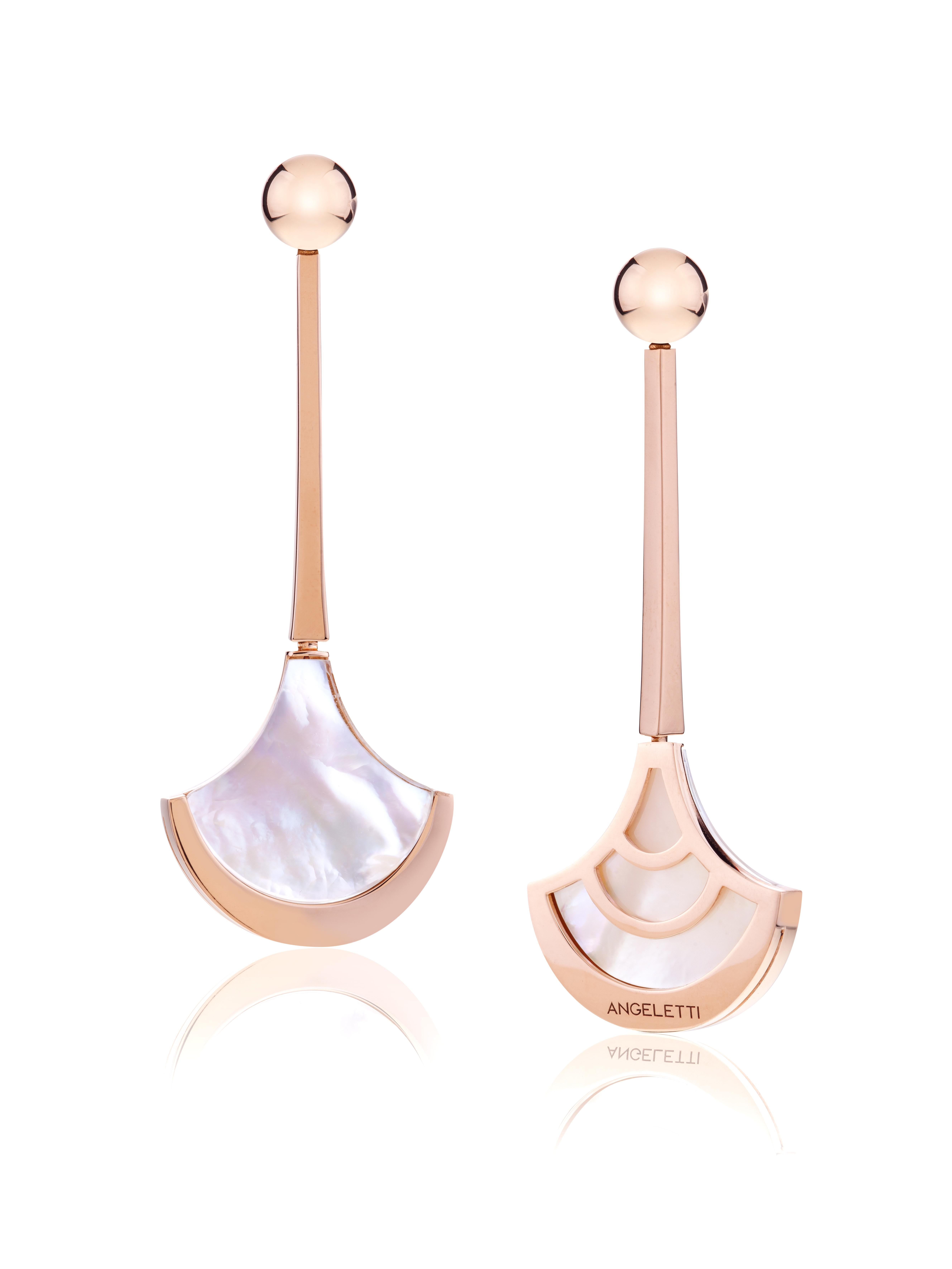 Earrings Rose Gold with Fan Shaped Mother of Pearl and Rock Crystal.
Everyday Earrings with precious doublette of Rock Crystal and Mother of Pearl with an extraordinary milky effect. 18kt Gold is around  20 grams. 
This model belongs to Wave
