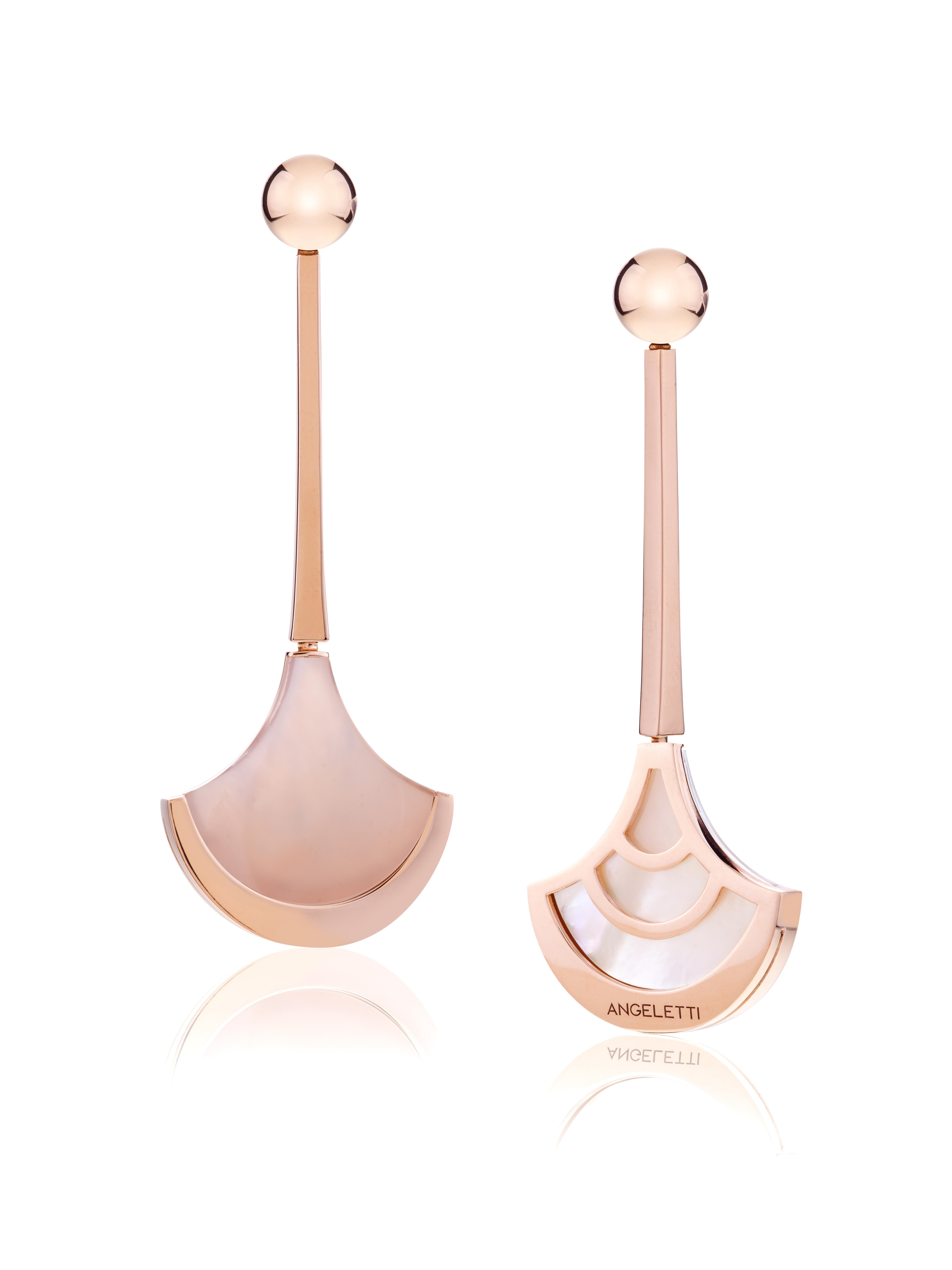 Earrings Rose Gold with Fun Shaped Rose Quartz and Mother of Pearl.
Everyday Earrings with precious doublette of Rose Quartz and Mother of Pearl with an extraordinary milky effect. 18kt Gold is around  20 grams. 
Angeletti Boasts an Exceptional