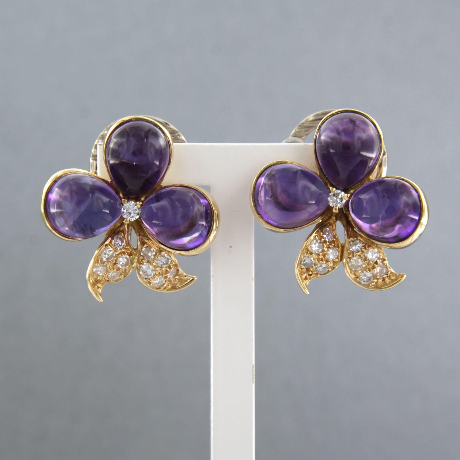 18k bicolor gold ear clips set with amethyst and brilliant and single cut diamonds. 0.25ct - G/H - VS/SI

detailed description:

the size of the ear clips is 2.0 cm by 2.0 cm wide

weight 11.3 grams

set with

- 6 x 7.8 mm x 7.0 mm drop shape