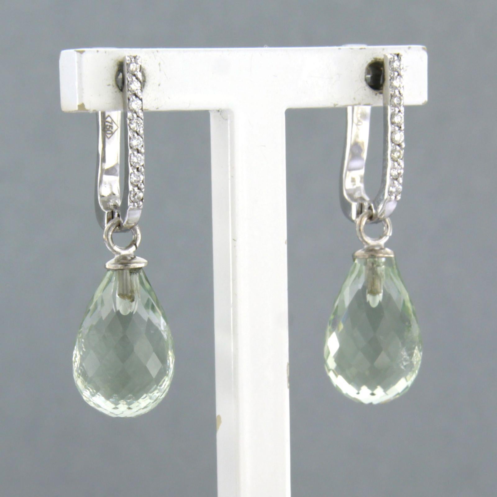 18k white gold earrings set with green amethyst and brilliant cut diamonds. 0.10ct - F/G – VS/SI

Detailed description:

the size of the earring is 2.8 cm long by 8.0 mm wide

Total weight 4.2 grams

set with

- 2 x 1.2 cm x 8.0 mm drop shape facet