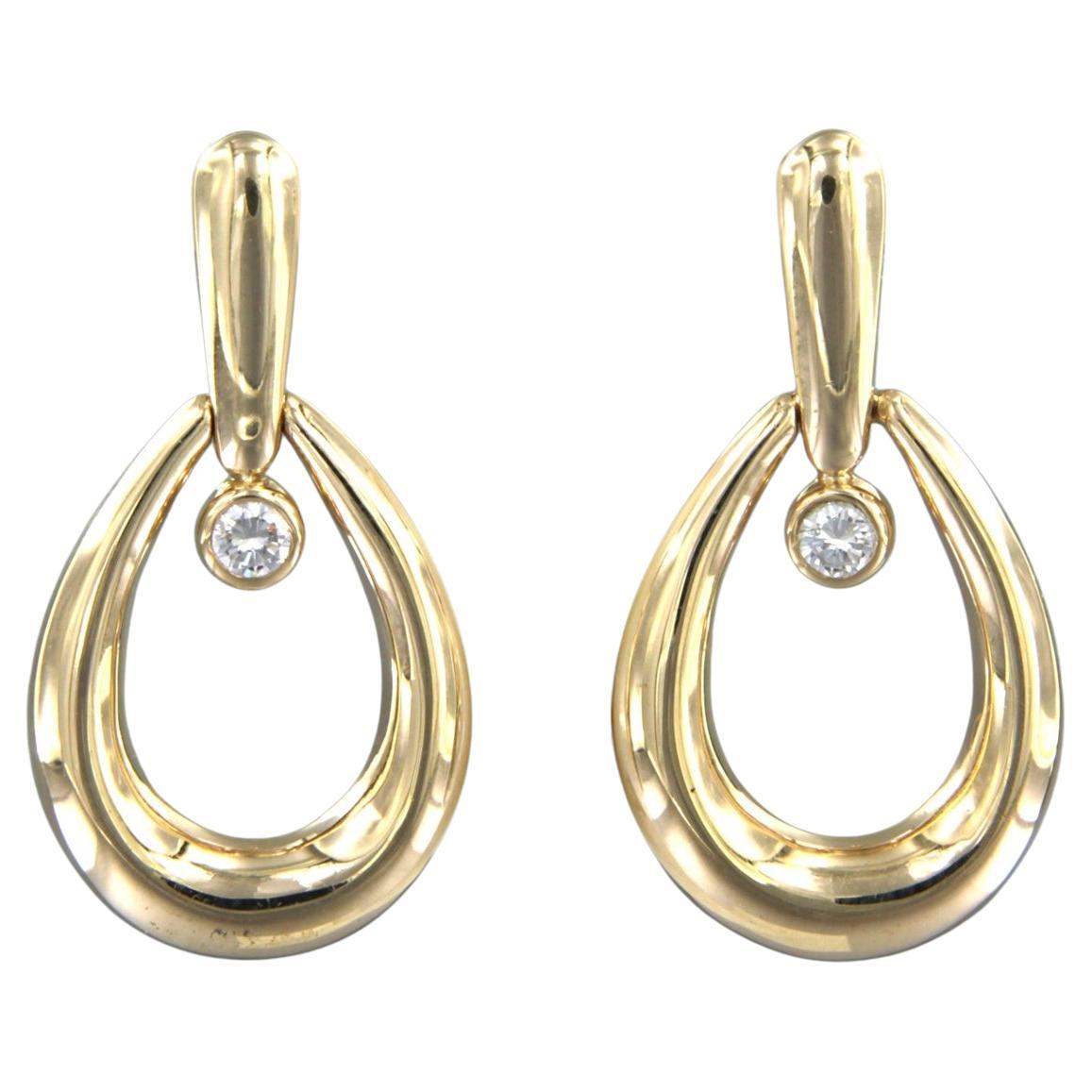 Earrings set with brilliant cut diamonds 14k yellow gold