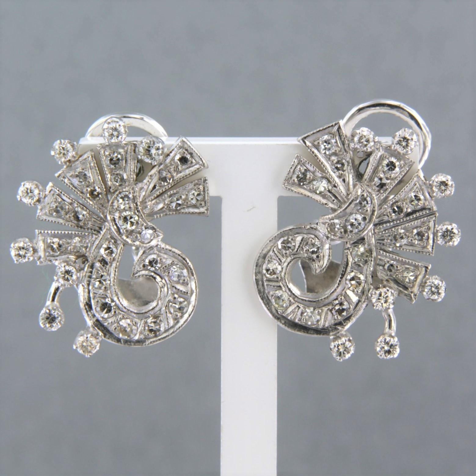 14k white gold clip-on earrings set with brilliant and single cut diamonds up to. 1.40ct - F/G - VS/SI

detailed description

Dimensions at the top of the ear clips are 2 cm x 1.5 cm, closure is a clip closure with a pin

weight 8.5 grams

occupied