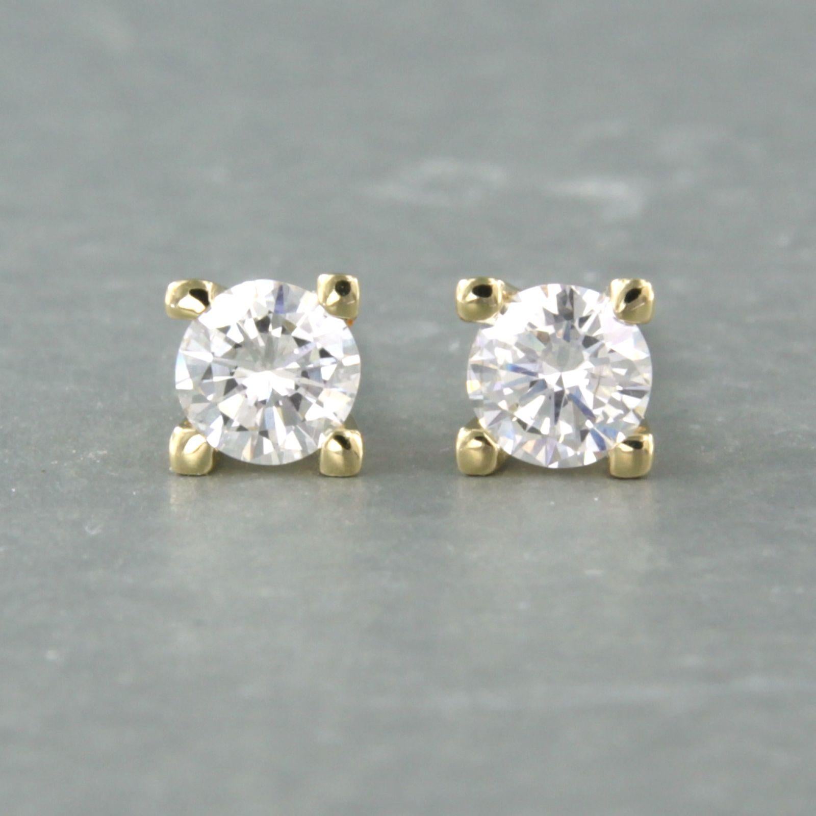 14k yellow gold solitaire ear studs set with brilliant cut diamonds up to 0.70ct - J/K - VS/SI

Detailed description:

The front of the ear stud is 5.0 mm wide

weight 1.8 grams

occupied with

- 2 x 4.4 mm brilliant cut diamond, total approximately