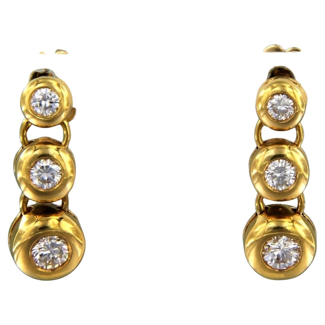 Earrings set with diamonds in total 0.65ct 18k yellow gold For Sale