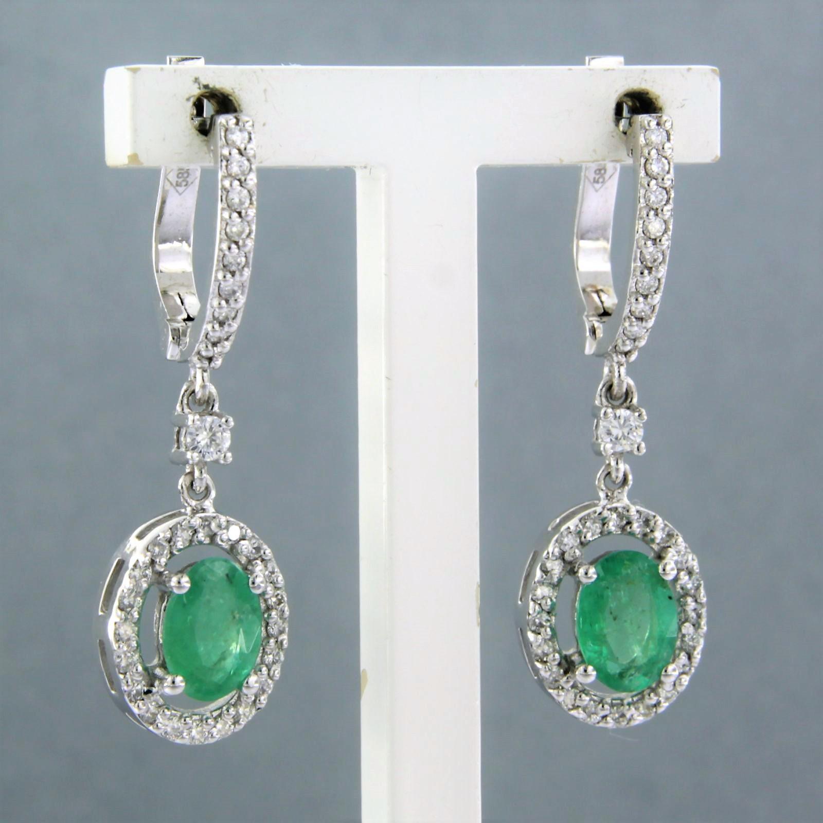 Modern Earrings set with emerald and diamonds 14k white gold For Sale