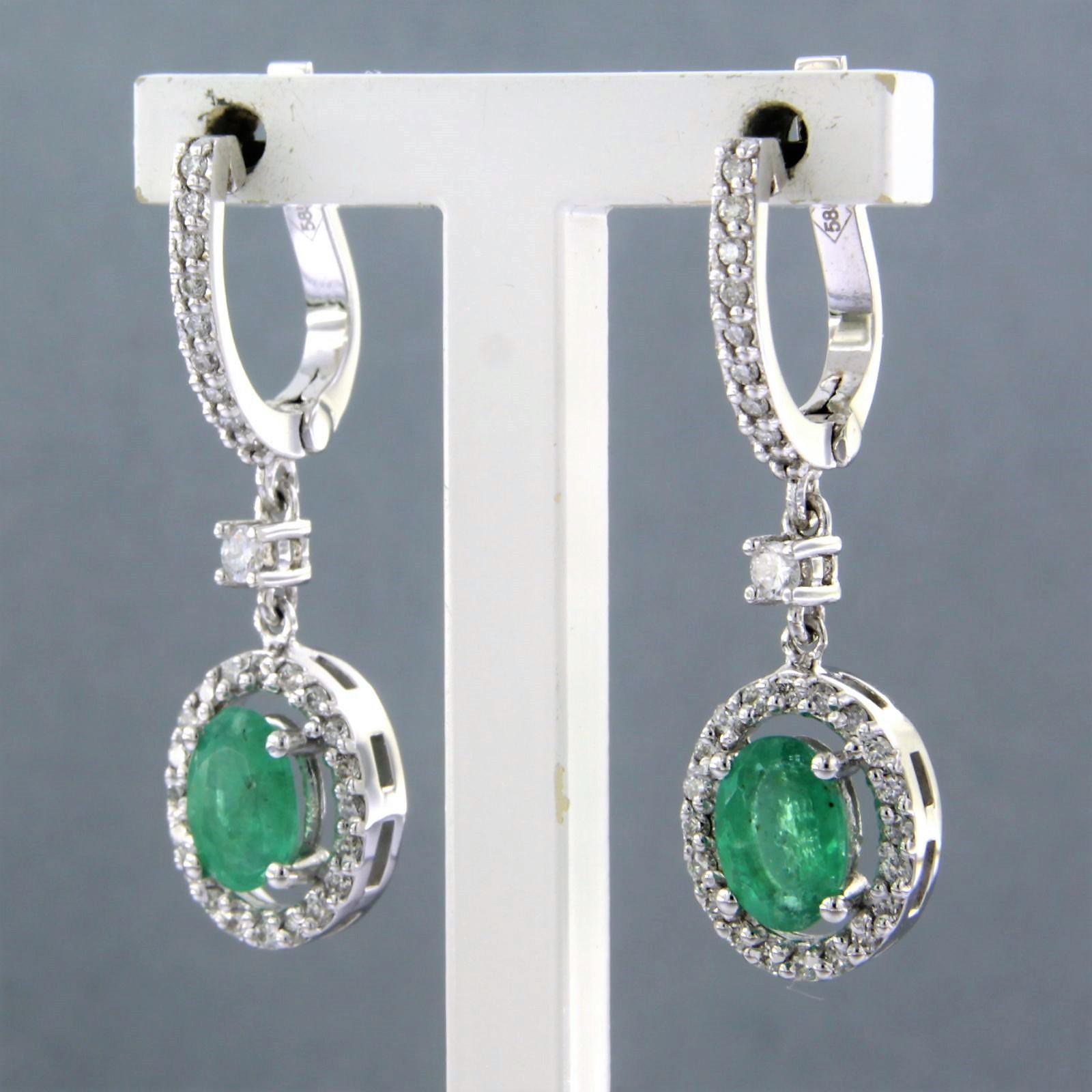 Brilliant Cut Earrings set with emerald and diamonds 14k white gold For Sale