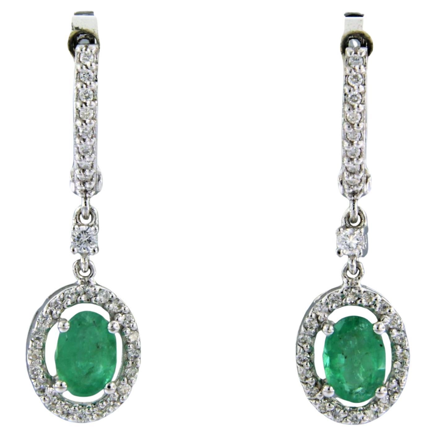 Earrings set with emerald and diamonds 14k white gold For Sale