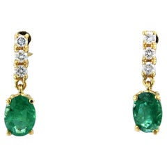 Earrings set with emerald and diamonds 18k yellow gold