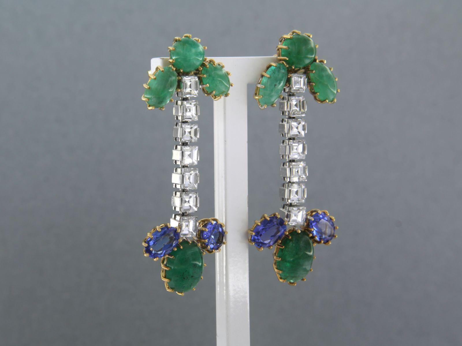 18k bicolour gold earrings set with emerald, tanzanite and princes cut diamonds, total approx 3.00 ct - F/G - VS/SI

Detailed description:

the size of the earring is 4.5 cm high and 1.8 cm wide
 
Total weight 12.5 grams

set with

- 4 x 7.0 mm x