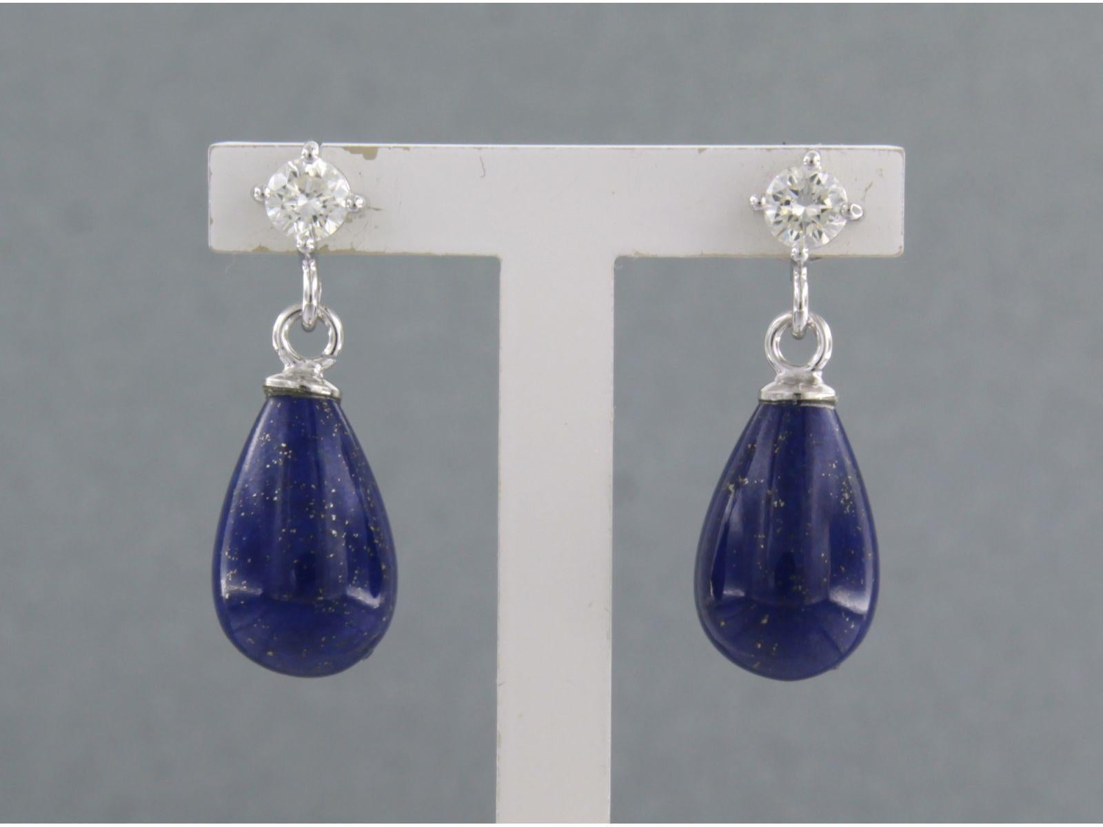 18k white gold earrings set with lapis lazuli and brilliant cut diamonds. 0.36ct - F/G - VS/SI

detailed description:

the size of the earring is 2.2 cm long by 8.2 mm wide

total weight: 4.2 grams

estimated gold weight 2.0 grams

occupied with:

-