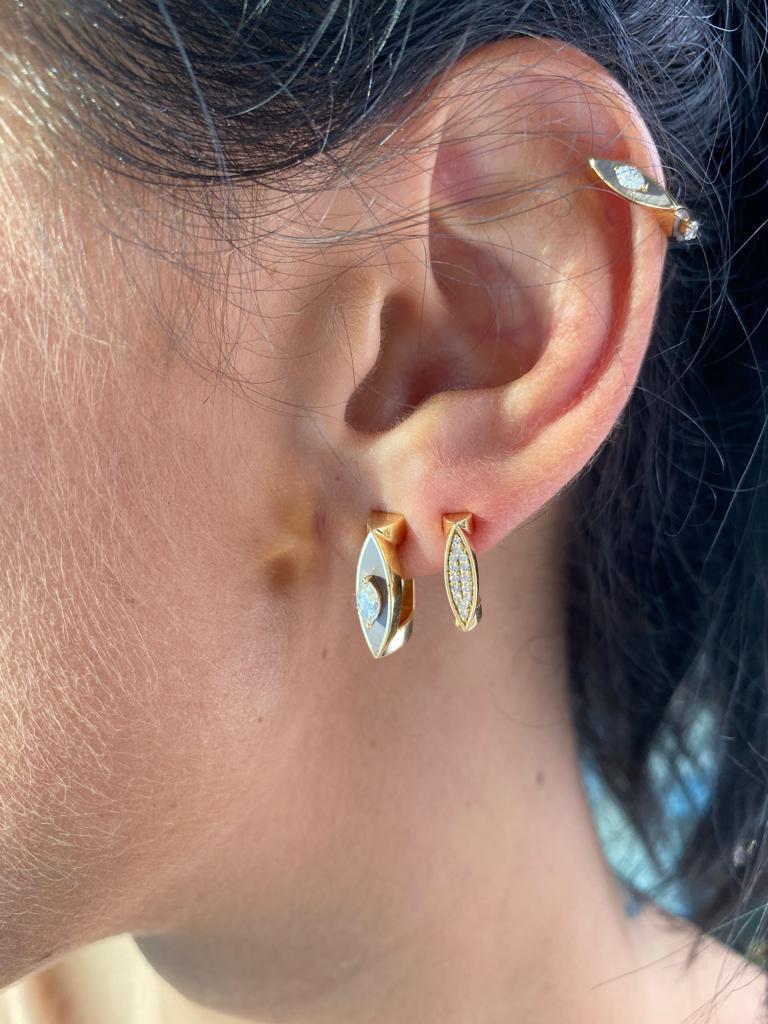 “Unstoppables” Collection. Ear Clips crafted in 18k gold and embellished with enamel inlay and set with a marquise shape solitaire.

The earrings display  “Light Veneto Brown/Nude” Enamel (this color is custom-made)

Customized colors are available