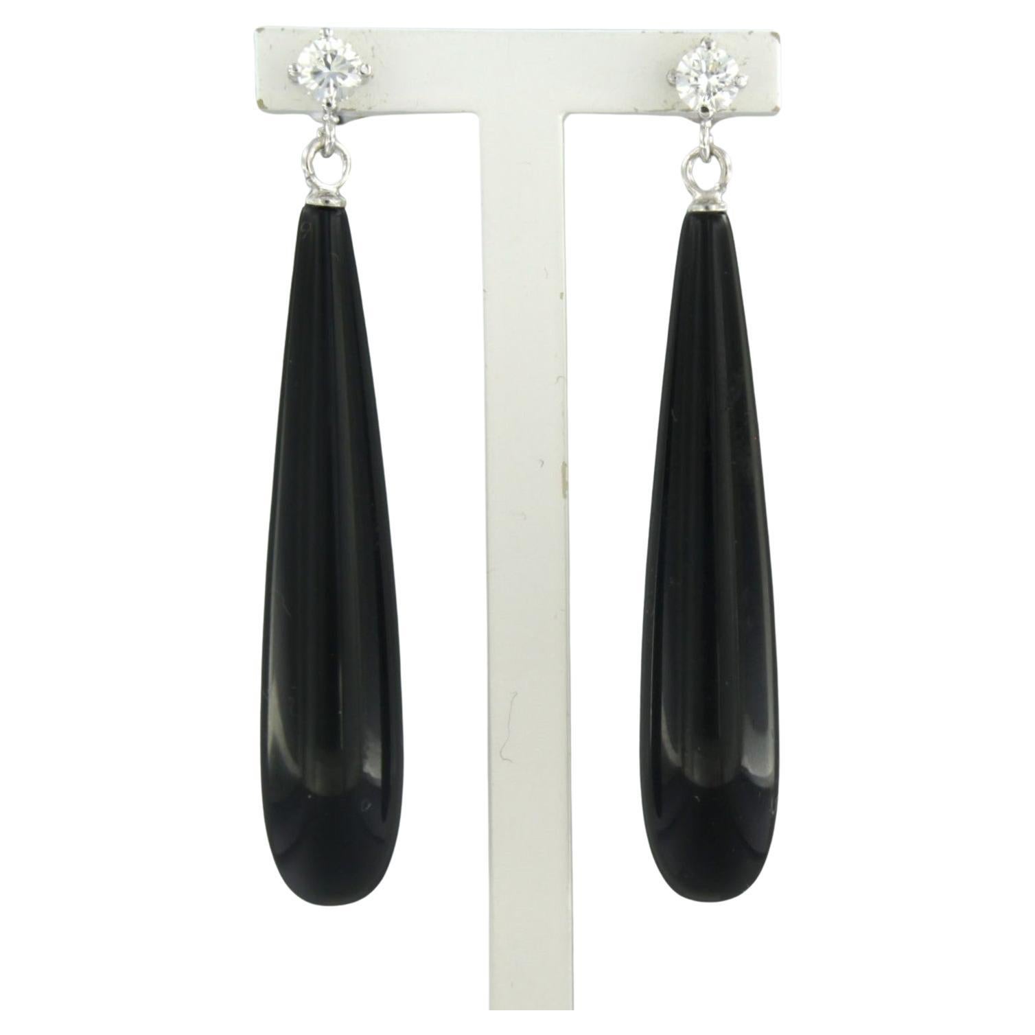 Earrings set with onyx and brilliant cut diamonds up to 0.38ct 18k white gold