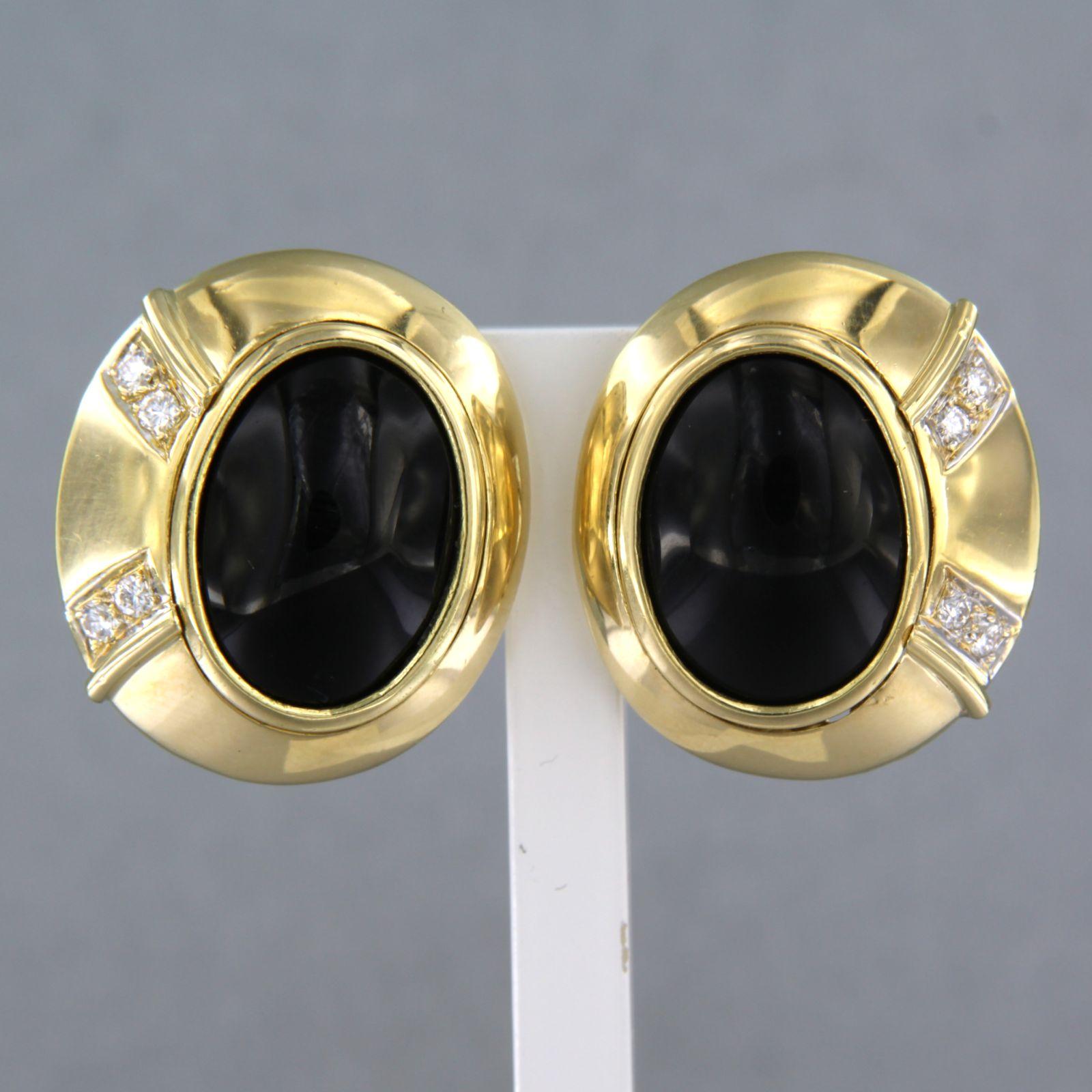 18k yellow gold clip-on earrings set with onyx and brilliant cut diamonds. 0.20ct - G/H - VS/SI

detailed description:

the size of the earring is 2.2 cm long by 1.9 cm wide

weight 18.5 grams

set with

- 2 x 1.5 cm x 1.1 cm oval cabochon cut