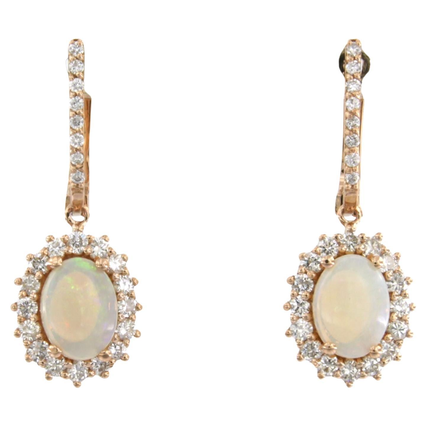 Earrings set with opal and brilliant cut diamonds up to 0.75ct 18k pink gold For Sale