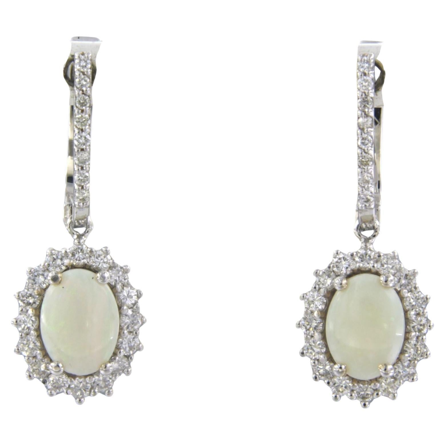 Earrings set with opal and diamonds 18k white gold For Sale