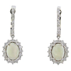 Earrings set with opal and diamonds 18k white gold