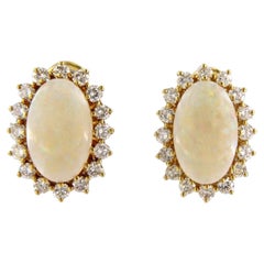 Earrings set with opal end diamonds 18k yellow gold